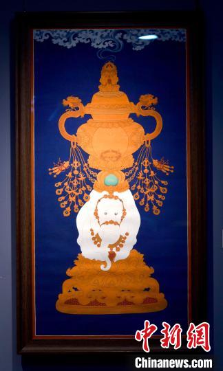 圖為5月16日，展覽中的新創(chuàng)唐卡作品《瑞象承香》?！±盍?攝